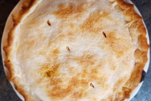 a photo of the golden brown top crust of a pie by owlcreek.ca