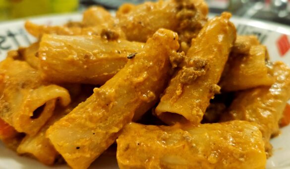 a photo of pasta covered in a cheesy beef sauce by owlcreek.ca